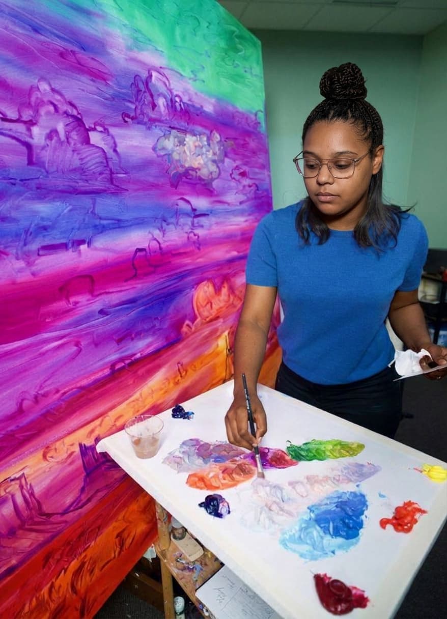 Alexandrea Roach painting in her studio